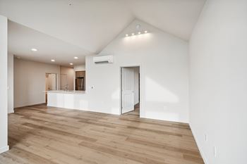 A room with wooden floors and white walls.